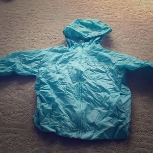 Baby blue little girls pouch able rain jacket